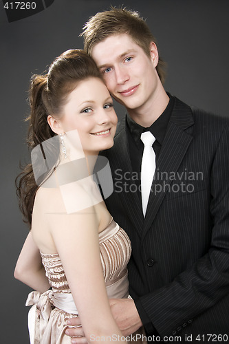 Image of Portrait of a young beautiful couple embracing.