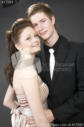 Image of Portrait of a young beautiful couple embracing.