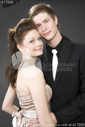 Image of Portrait of a young beautiful couple embracing.