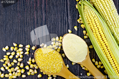 Image of Flour and grits corn in spoons on wooden board