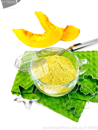 Image of Flour pumpkin in glass cup on green napkin