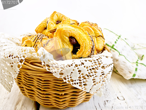 Image of Cookies with dates in basket with napkin on board