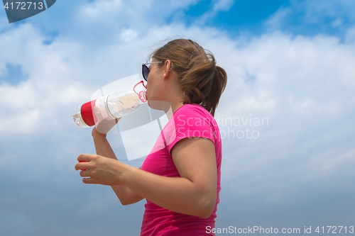 Image of Woman drinking clean water
