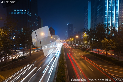 Image of Light trails on motorway highway at night