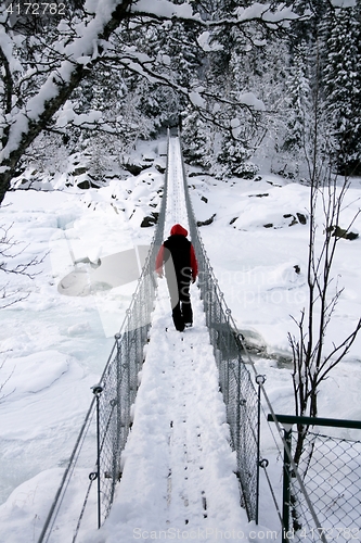 Image of Man on suspension bridge