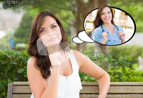 Image of Thoughtful Young Woman with Herself as a Doctor or Nurse Inside 