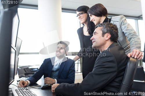 Image of Business team working in corporate office.