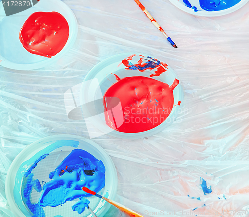 Image of Red And Blue Paints In Plastic Plates