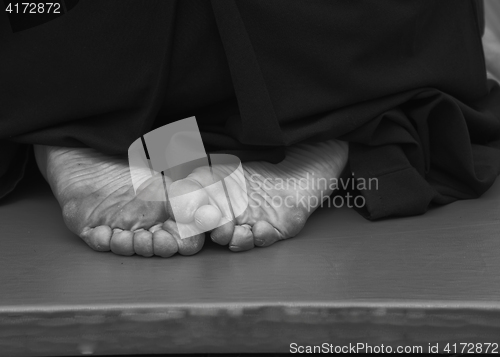 Image of aikido fighter foot on the mat