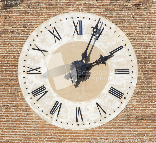 Image of Old Cathedral clock on brick wall, Bassano, Italy