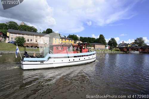 Image of PORVOO, FINLAND – AUGUST 3, 2016: a sightseeing boat on the ri