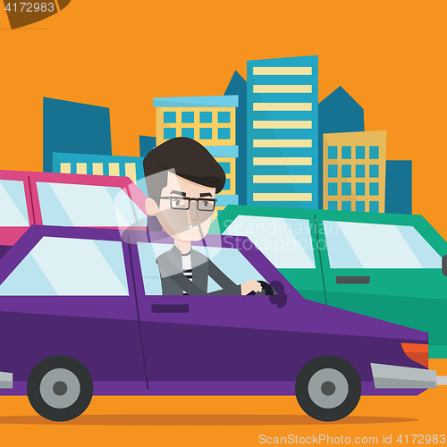 Image of Angry caucasian man in car stuck in traffic jam.