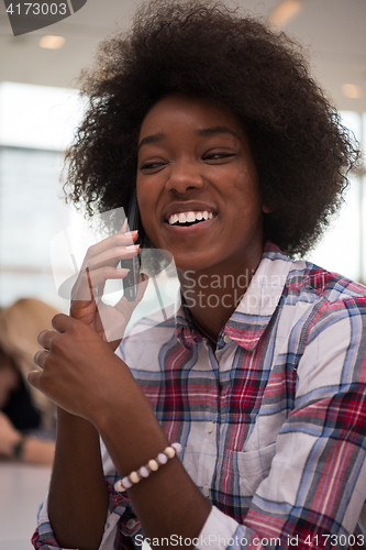 Image of African American informal business woman working in the office