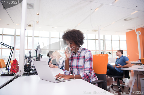 Image of African American informal business woman working in the office