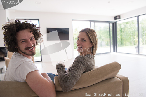 Image of Rear view of couple watching television