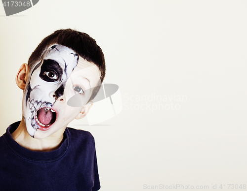 Image of little cute boy with facepaint like skeleton to celebrate hallow