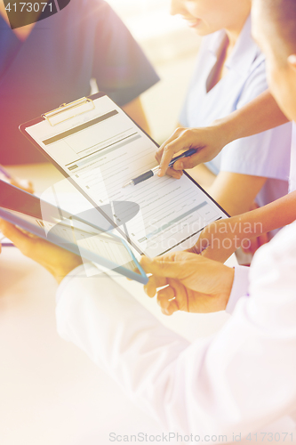 Image of close up of doctors with clipboard at hospital