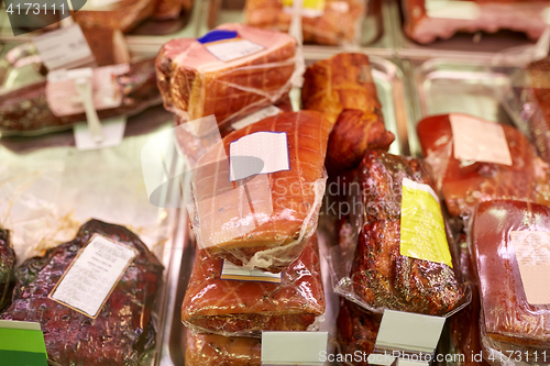 Image of ham at grocery store stall