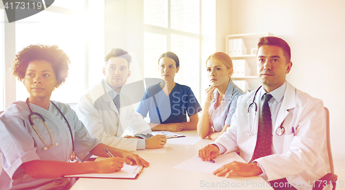 Image of group of happy doctors meeting at hospital office