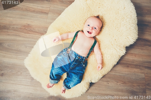 Image of Cheerful baby at home