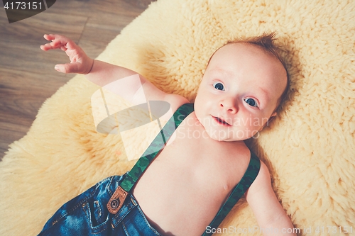 Image of Cheerful baby at home