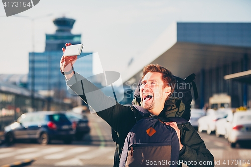 Image of Traveler taking a selfie at the airport