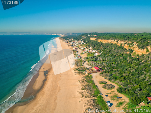 Image of Aerial View Empty Sandy Beach with Small Waves