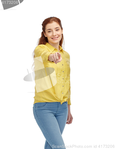 Image of happy young woman pointing finger on you