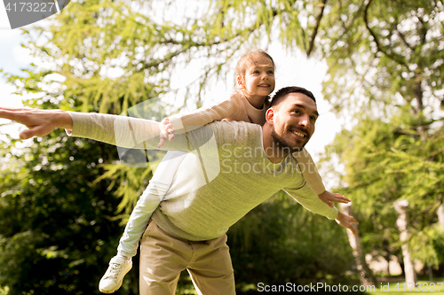 Image of happy family having fun in summer park