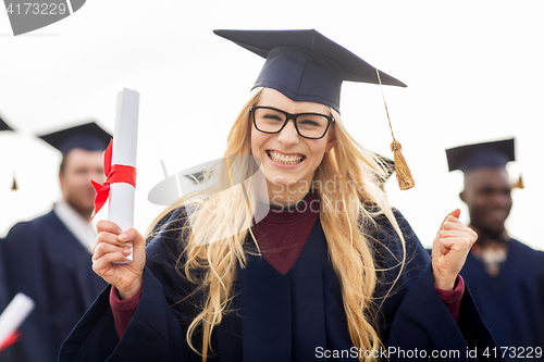 Image of happy student with diploma celebrating graduation