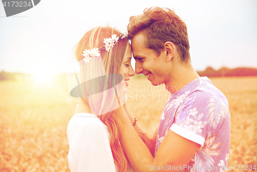 Image of happy smiling young hippie couple outdoors