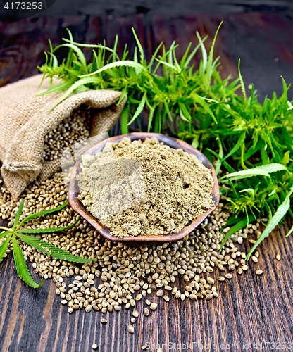 Image of Flour hemp in bowl with grain in bag on board