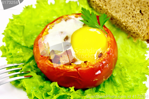 Image of Scrambled eggs in tomato with ham and mushrooms