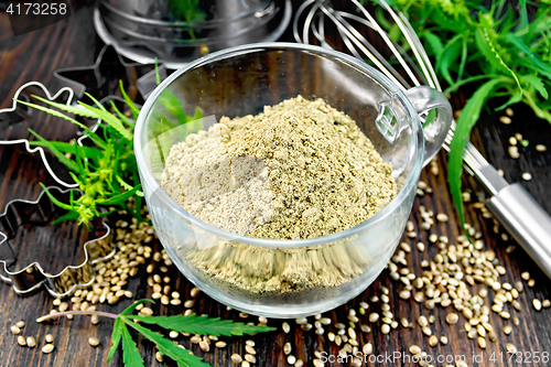 Image of Flour hemp in glass cup with leaf on board