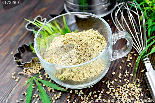 Image of Flour hemp in glass cup on board