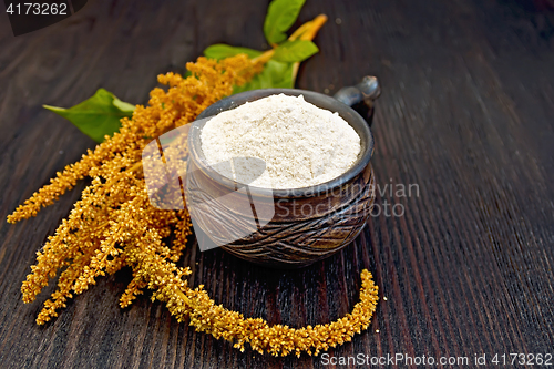 Image of Flour amaranth in clay cup on dark board