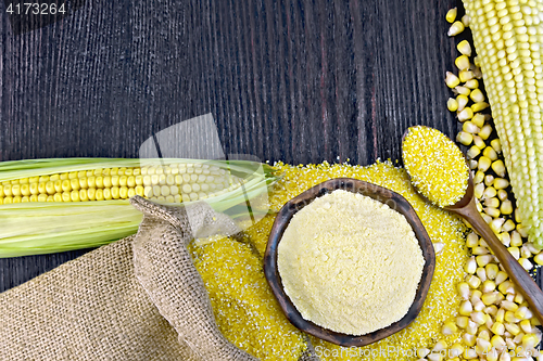 Image of Flour and grits corn with bag on wooden board