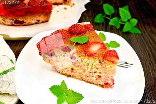 Image of Pie strawberry with jelly in white plate on board