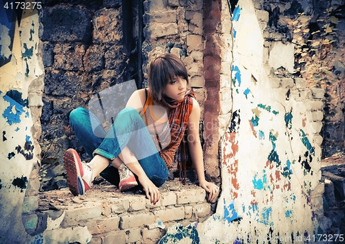 Image of Young Woman In The Ruins With Graffiti