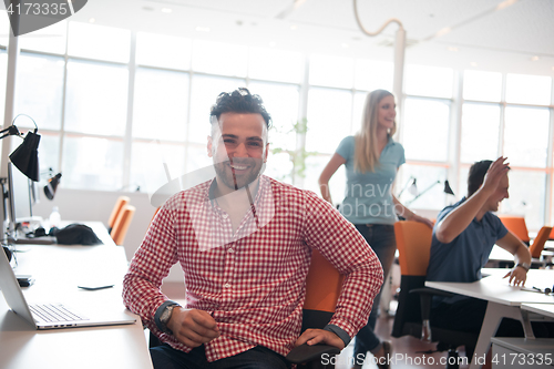 Image of Portrait of young informal businessman
