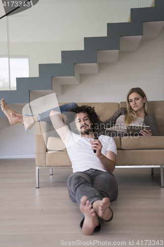 Image of young couple relaxes in the living room