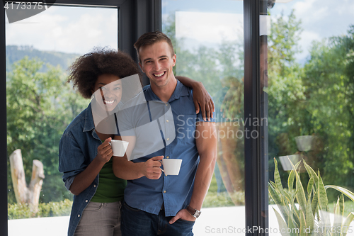 Image of romantic happy young couple relax at modern home indoors