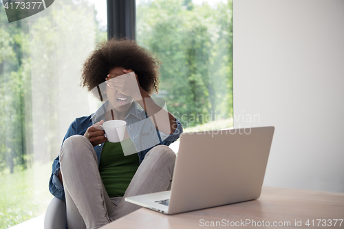 Image of African American woman in the living room