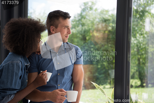 Image of romantic happy young couple relax at modern home indoors
