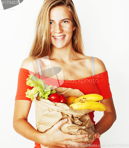 Image of young pretty blond woman at shopping with food in paper bag isol