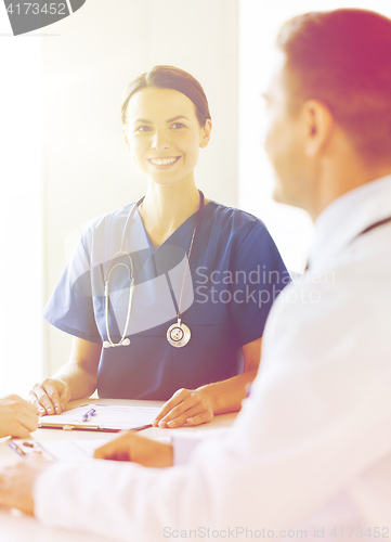 Image of group of happy doctors meeting at hospital office