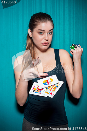 Image of sexy woman with poker cards