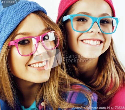 Image of lifestyle people concept: two pretty stylish modern hipster teen girl having fun together, happy smiling making selfie 