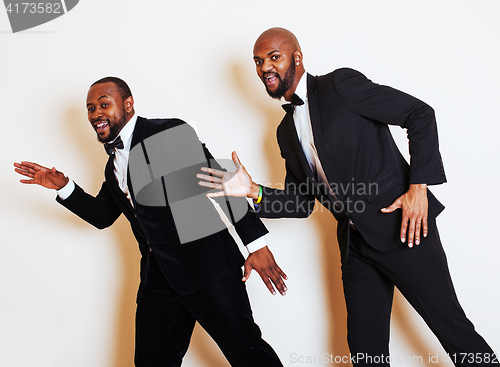 Image of two afro-american businessmen in black suits emotional posing, g