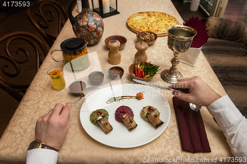 Image of Man eating in georgian restaurant